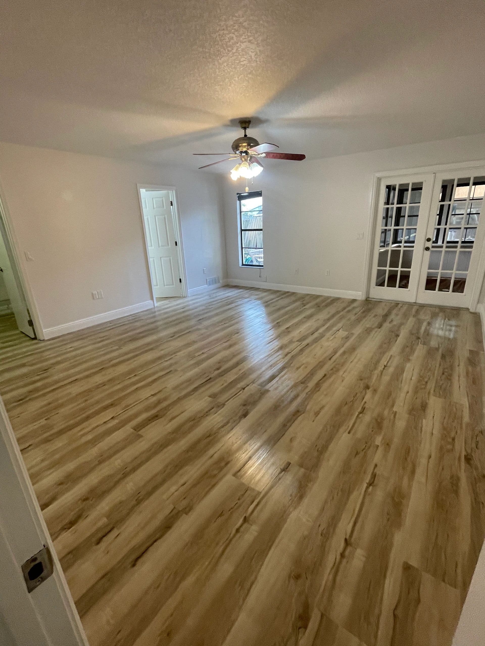 Newly installed wood-look plank flooring
